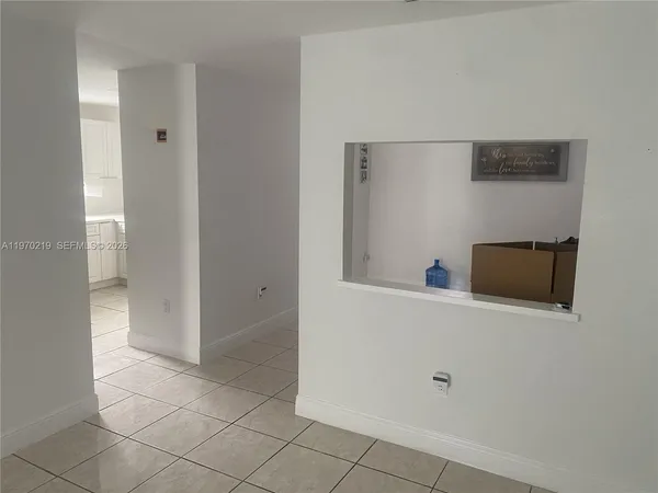 a kitchen with a sink cabinets and window