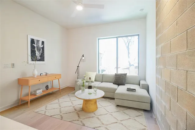 a living room with furniture and a table