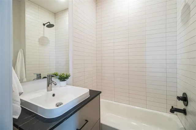 a bathroom with a sink and a bathtub