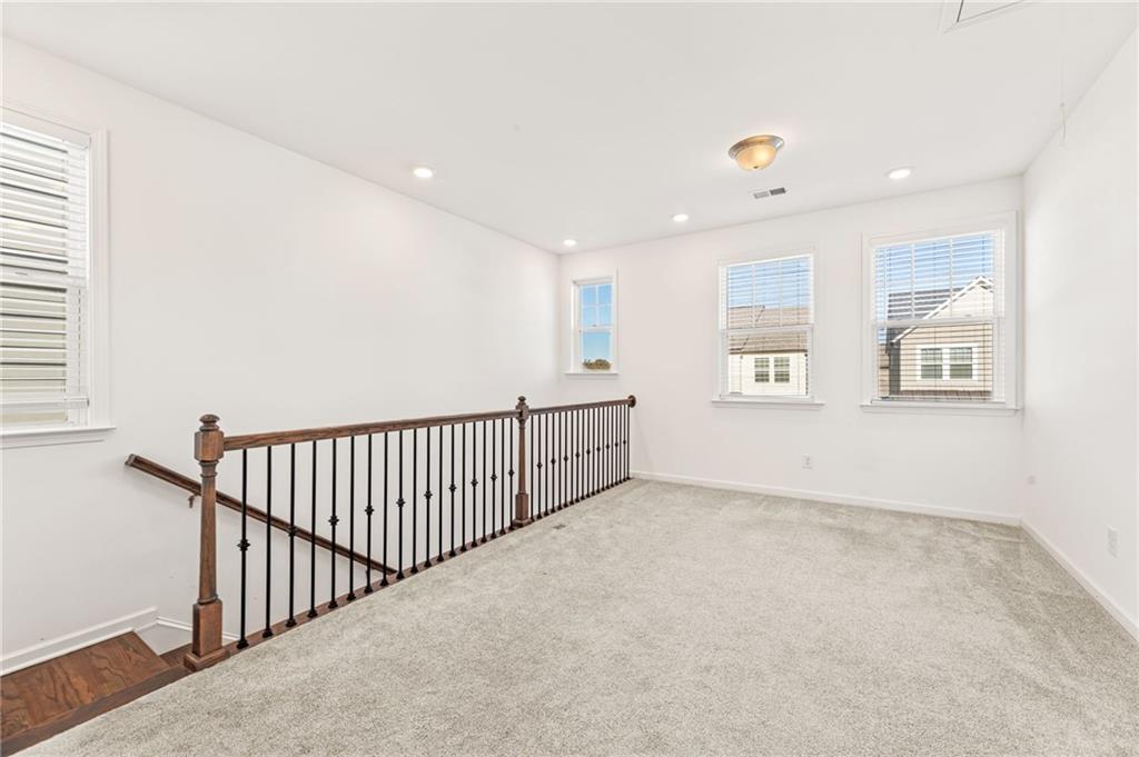 4734 Dewitt Drive Duluth, GA 30097 - Photo 21 of 31 a view of an empty room with windows
