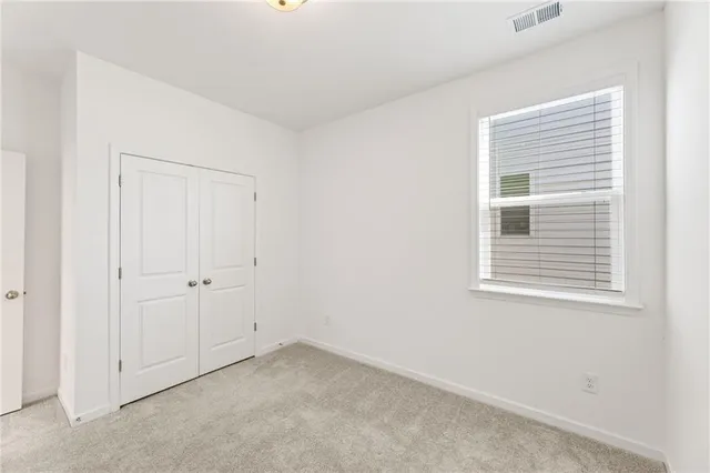 a view of empty room with windows