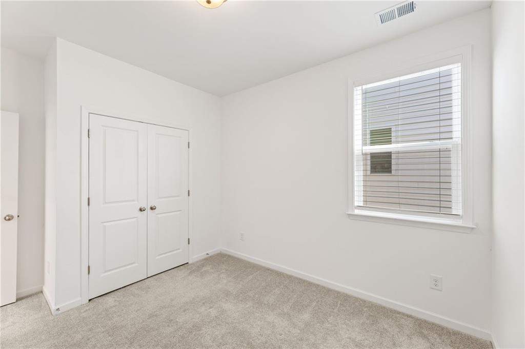 4734 Dewitt Drive Duluth, GA 30097 - Photo 27 of 31 a view of empty room with windows