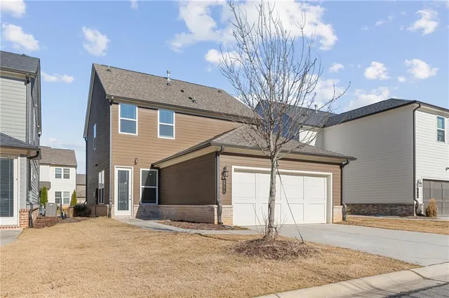 a front view of a house with a garage