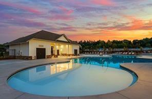 4734 Dewitt Drive Duluth, GA 30097 - Photo 4 of 31 a view of a house with swimming pool and a chairs