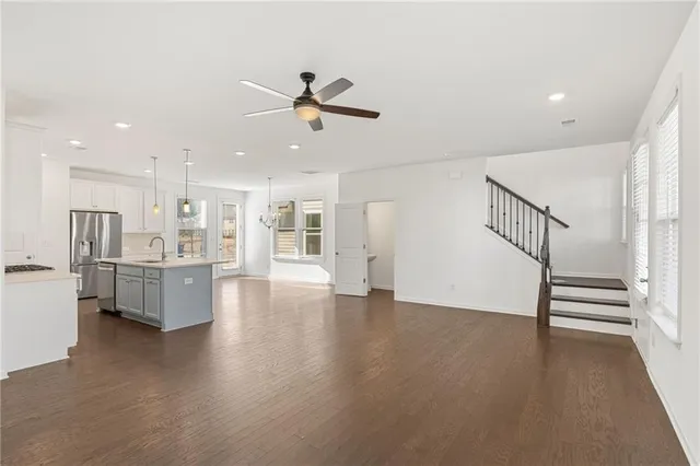 a view of kitchen with furniture and wooden floor