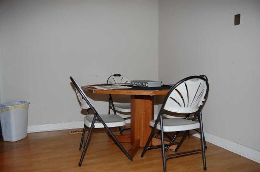 1303 Yarmouth Court, Unit 1303 Schaumburg, IL 60193 - Photo 4 of 11 a view of a dining room with furniture and wooden floor