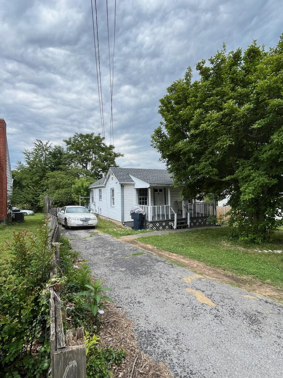 1130 Ethel Road Southeast Roanoke, VA 24014 - Photo 3 of 4 a view of a big yard next to a house