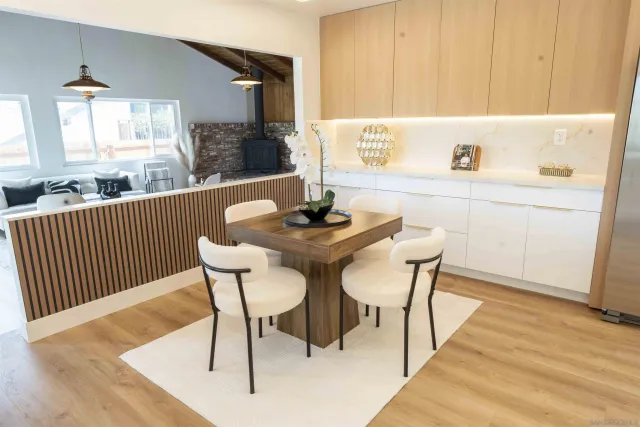 a view of a hallway with wooden floor and stairs