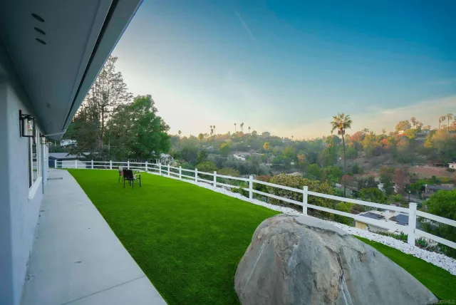 a view of a door and wooden floor