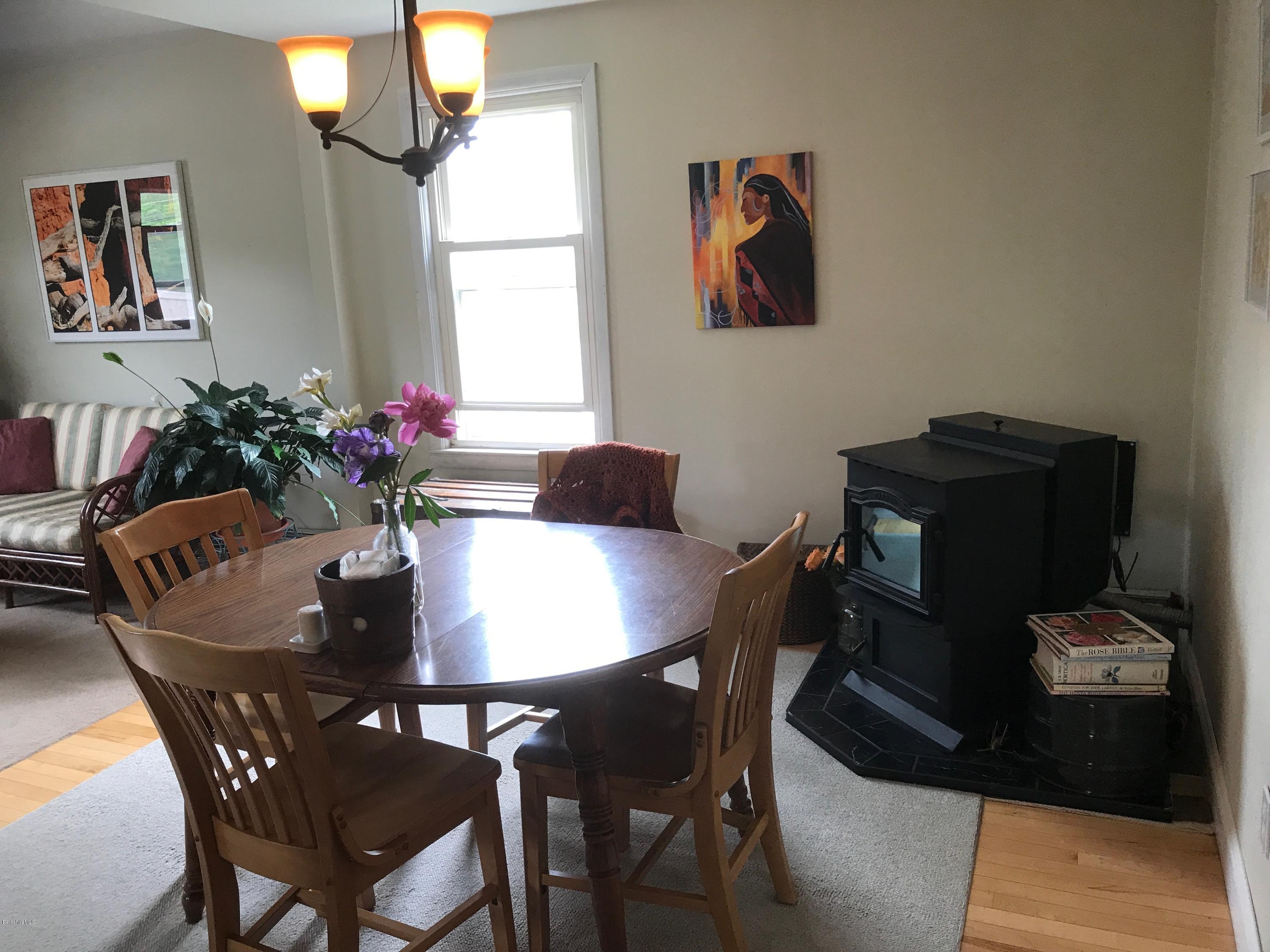 664 State Road North Adams, MA 01247 - Photo 13 of 26 dining room with pellet stove