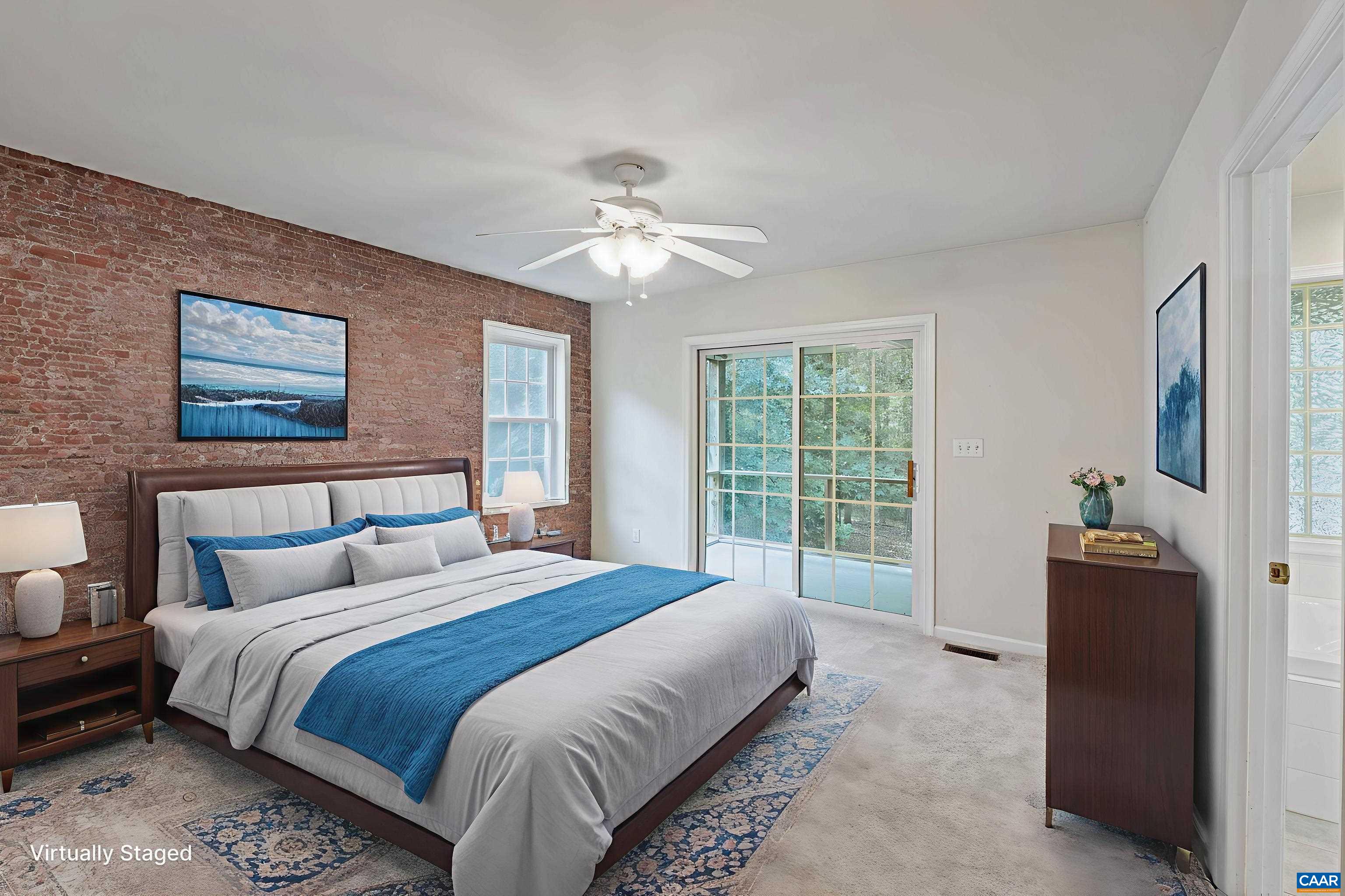 12 Cliftwood Road Palmyra, VA 22963 - Photo 28 of 47 a bedroom with a large bed and a chandelier