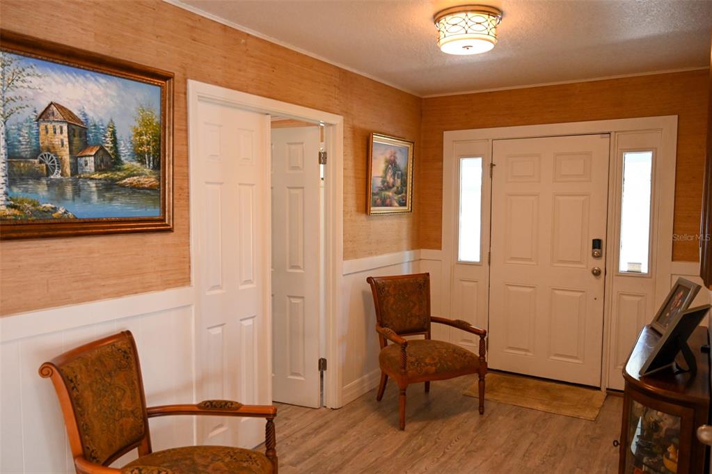 4501 Detour Road Haines City, FL 33844 - Photo 15 of 65 a view of a livingroom with furniture and wooden floor