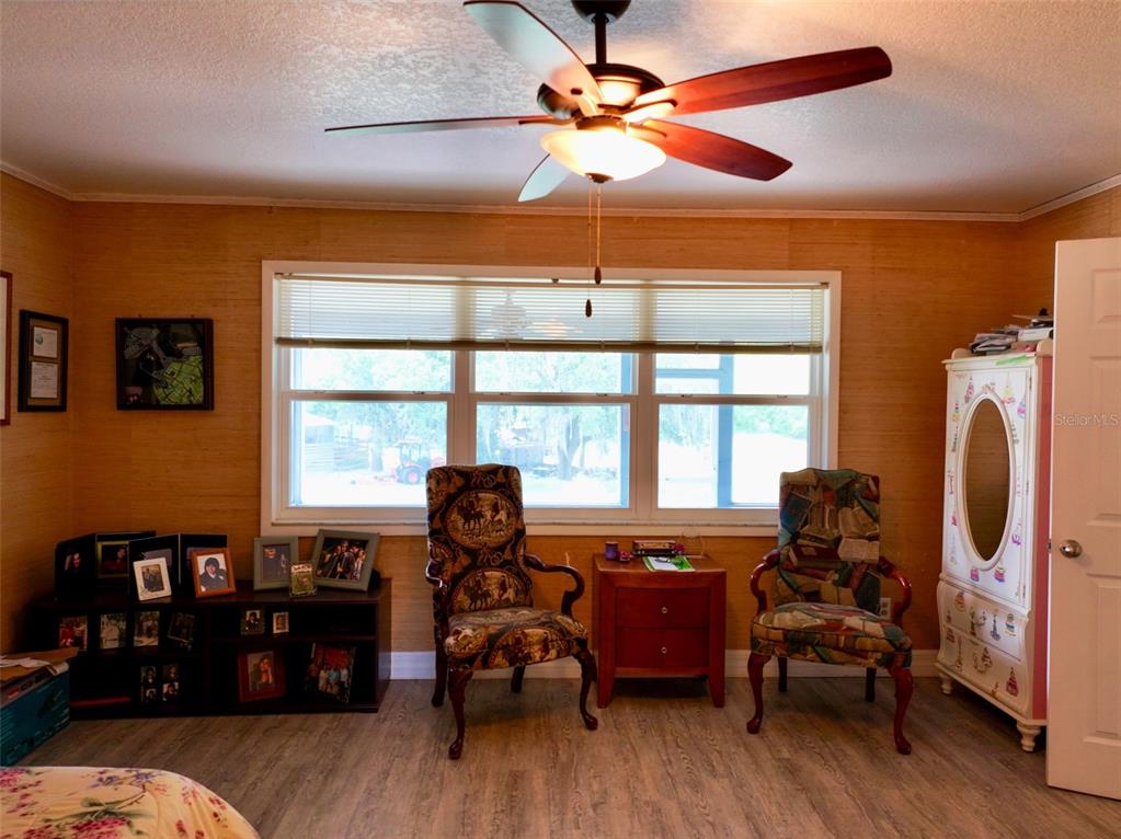4501 Detour Road Haines City, FL 33844 - Photo 16 of 65 a living room with furniture fireplace and a large window