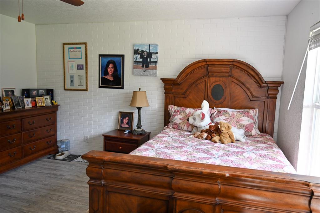 4501 Detour Road Haines City, FL 33844 - Photo 24 of 65 a bedroom with a bed and a dresser