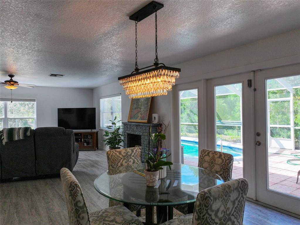 4501 Detour Road Haines City, FL 33844 - Photo 25 of 65 a living room with furniture a flat screen tv and a large window
