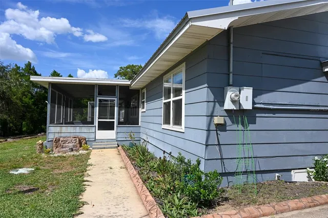a backyard of a house with lots of green space