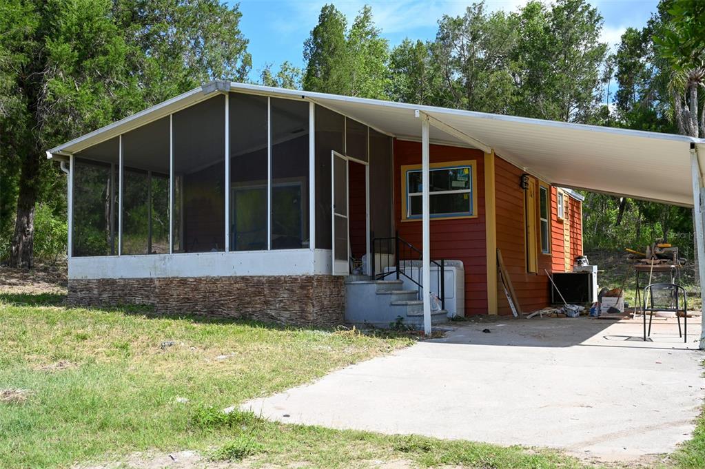 4501 Detour Road Haines City, FL 33844 - Photo 35 of 65 a front view of a house with a garden