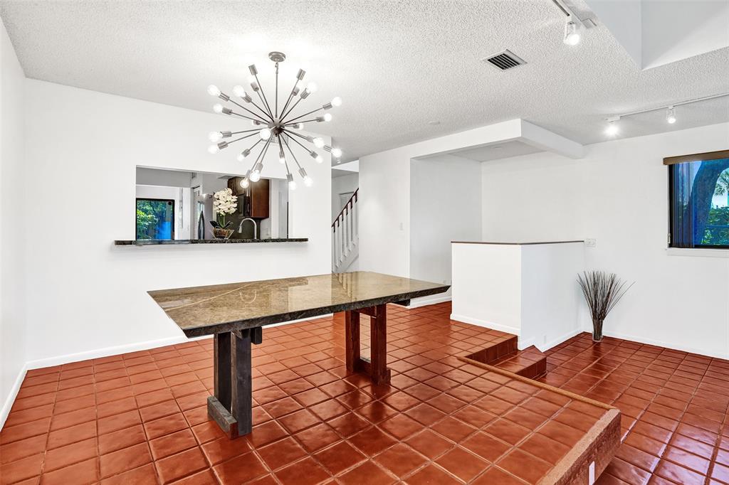 81 Northeast 17th Court Fort Lauderdale, FL 33305 - Photo 20 of 70 a view of a room with furniture and wooden floor