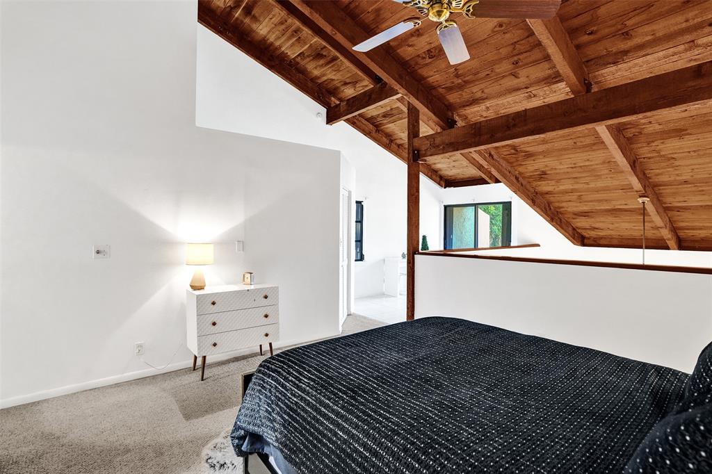 81 Northeast 17th Court Fort Lauderdale, FL 33305 - Photo 29 of 70 a bedroom with a bed and wooden floor