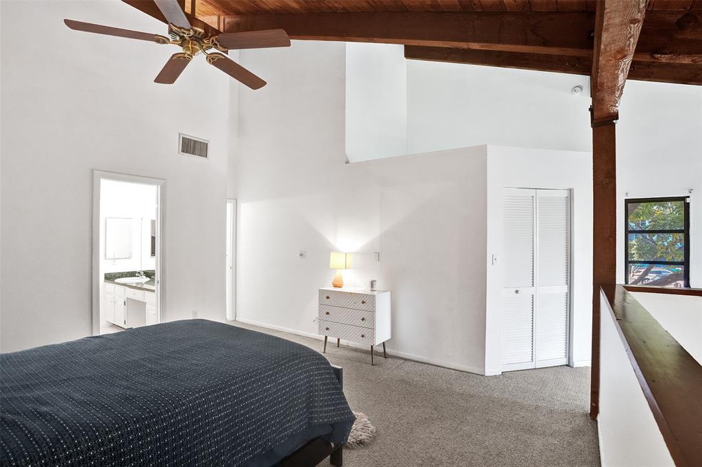 81 Northeast 17th Court Fort Lauderdale, FL 33305 - Photo 35 of 70 a bedroom with a bed and a chandelier