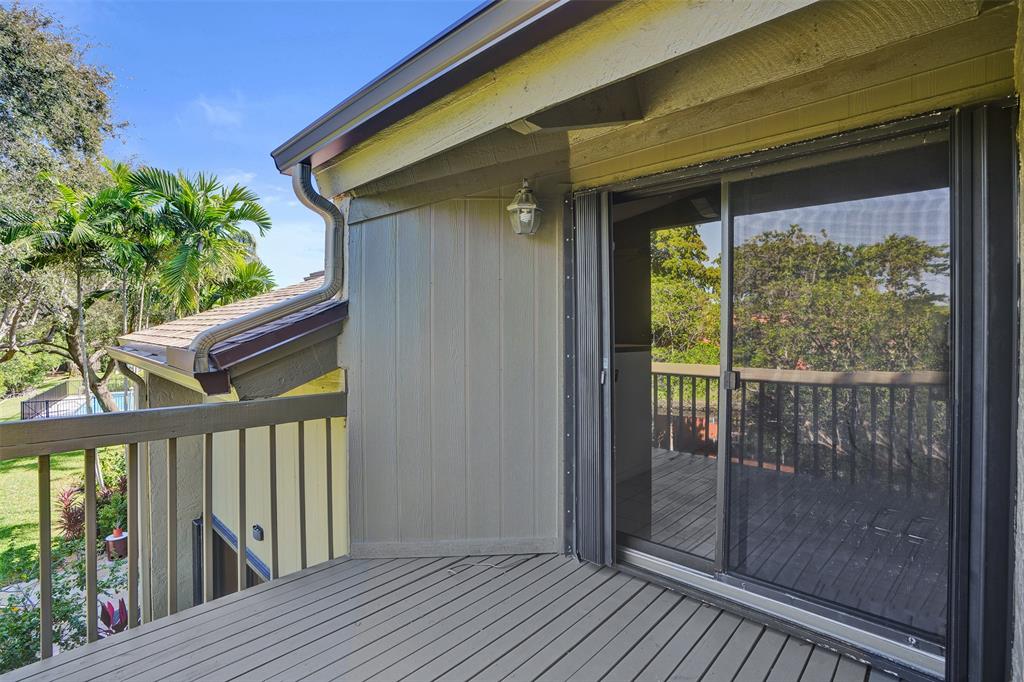 81 Northeast 17th Court Fort Lauderdale, FL 33305 - Photo 39 of 70 a view of a balcony with wooden floor