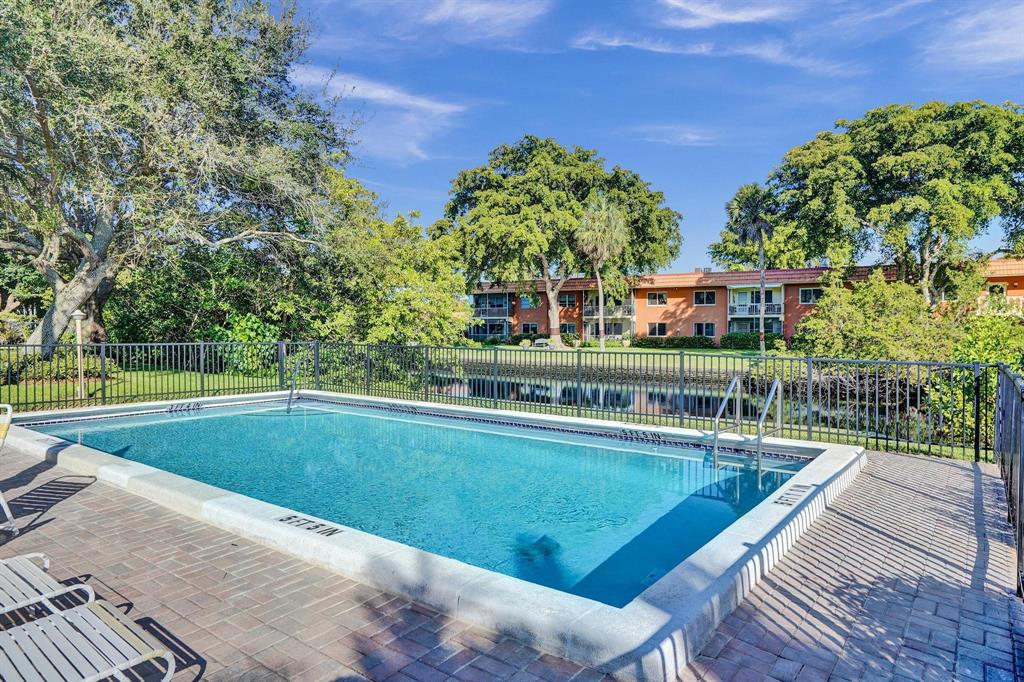 81 Northeast 17th Court Fort Lauderdale, FL 33305 - Photo 49 of 70 a view of a swimming pool with a patio