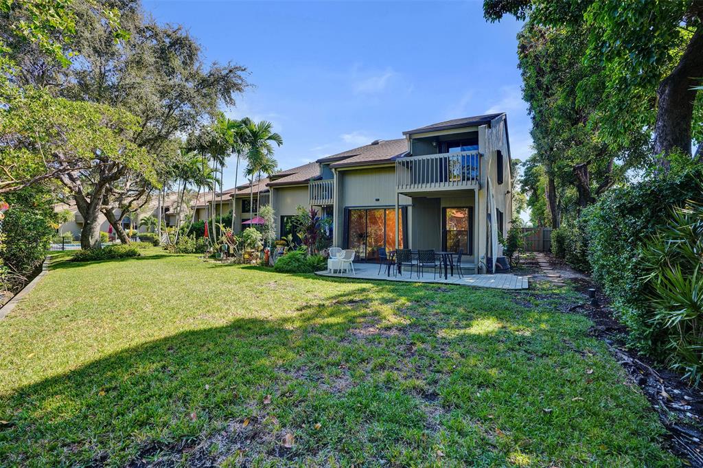 81 Northeast 17th Court Fort Lauderdale, FL 33305 - Photo 50 of 70 a view of a house with backyard and sitting area