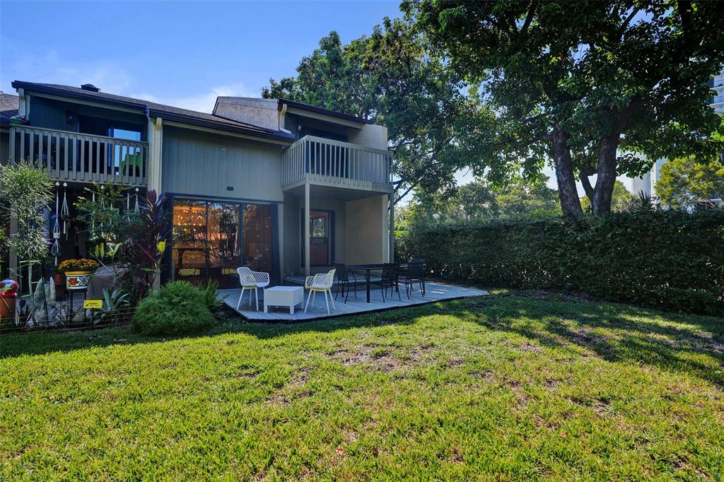 81 Northeast 17th Court Fort Lauderdale, FL 33305 - Photo 52 of 70 a view of a house with backyard and sitting area