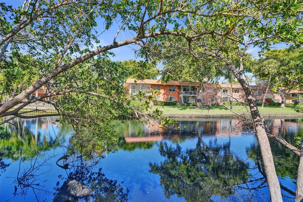 81 Northeast 17th Court Fort Lauderdale, FL 33305 - Photo 56 of 70 a view of a lake with a house in background