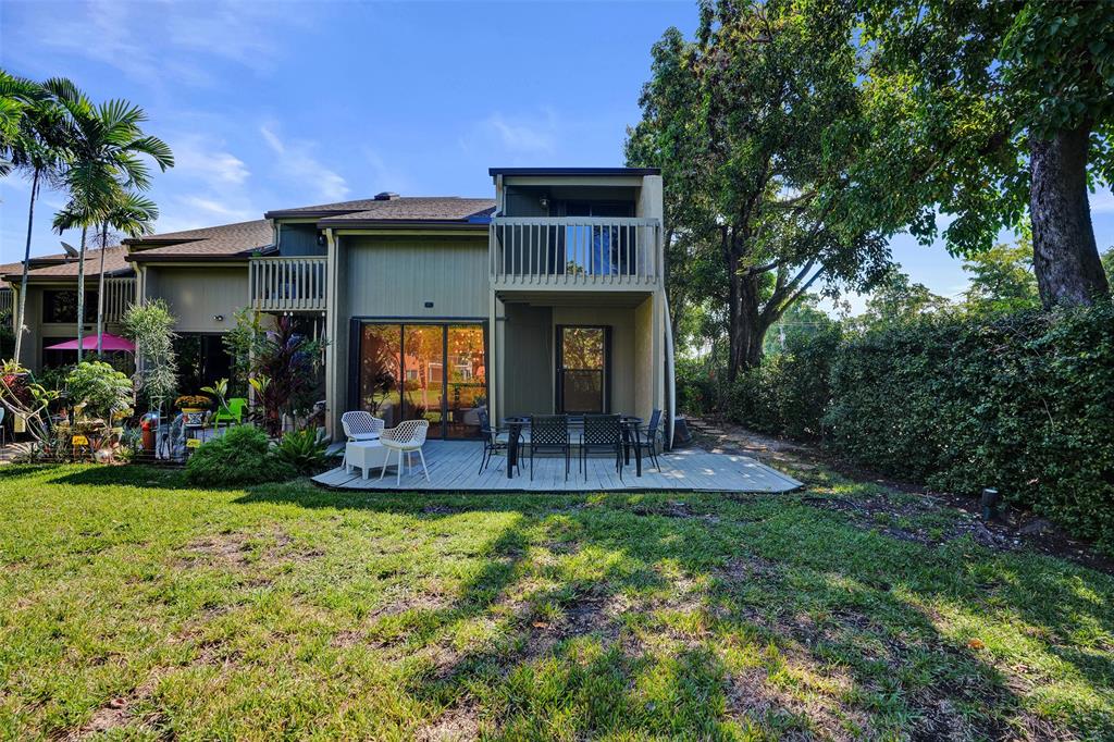 81 Northeast 17th Court Fort Lauderdale, FL 33305 - Photo 60 of 70 a view of a house with backyard and sitting area