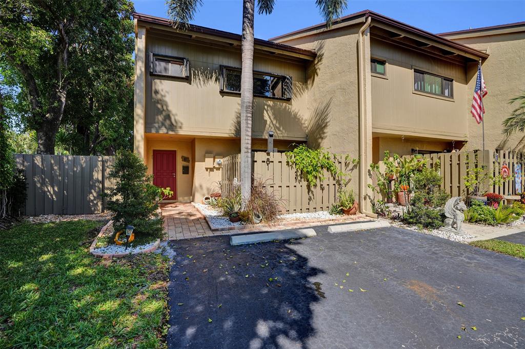 81 Northeast 17th Court Fort Lauderdale, FL 33305 - Photo 62 of 70 a front view of a house with garden