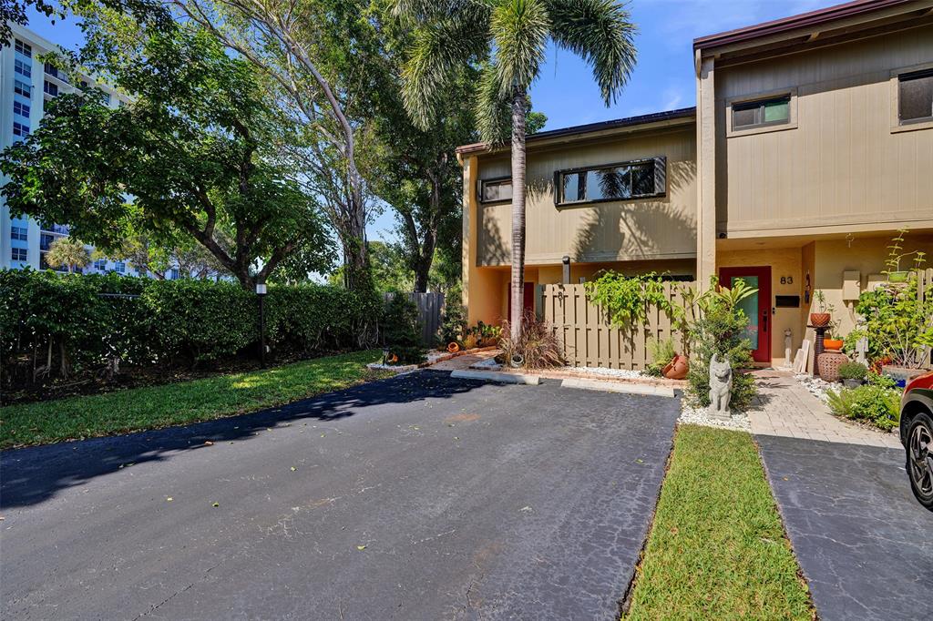 81 Northeast 17th Court Fort Lauderdale, FL 33305 - Photo 63 of 70 a front view of a house with garden