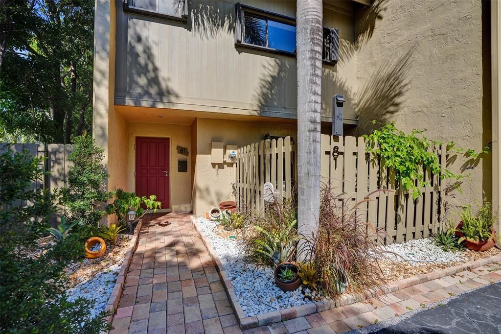 81 Northeast 17th Court Fort Lauderdale, FL 33305 - Photo 64 of 70 a view of a house with potted plants