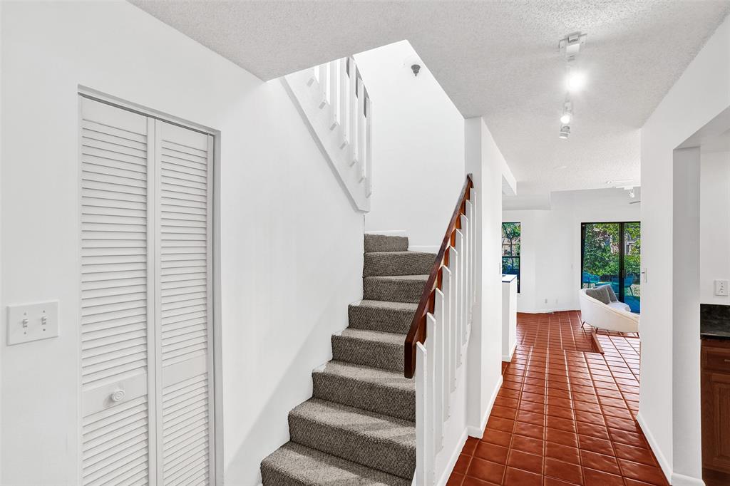 81 Northeast 17th Court Fort Lauderdale, FL 33305 - Photo 8 of 70 a view of entryway with wooden floor and stairs