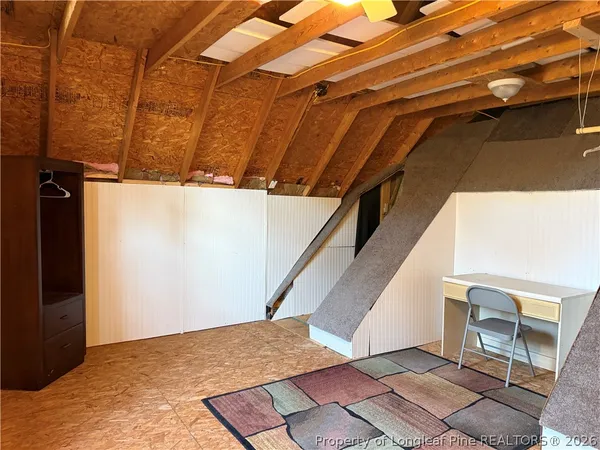 a view of an empty room with windows