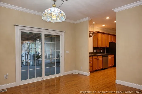 a view of kitchen with granite countertop cabinets and stainless steel appliances