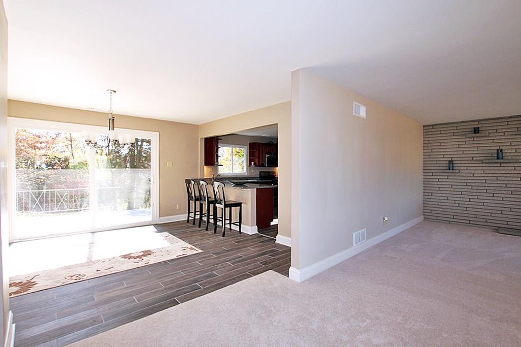 SPACIOUS DINING ROOM WITH OVERSIZED SLIDING DOOR TO PATIO