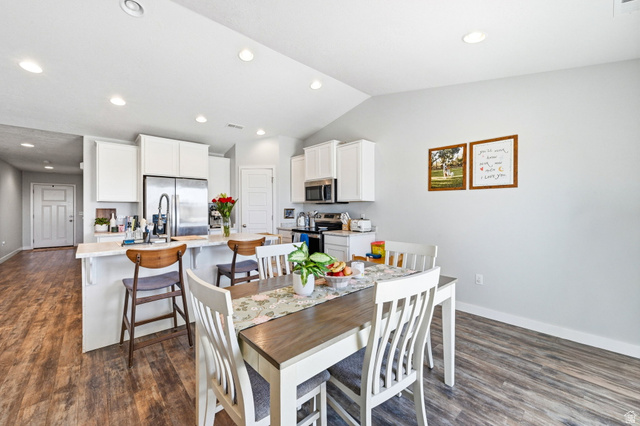 1175 Silver Hollow Road Syracuse, UT 84075 - Photo 15 of 34 Kitchen and dining area featuring wood-finish flooring