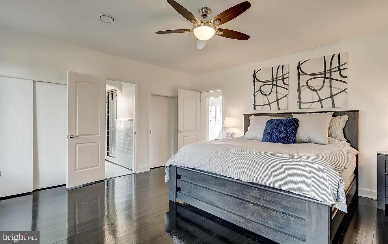 8040 Leishear Road Laurel, MD 20723 - Photo 16 of 66 a bedroom with a bed and a chandelier