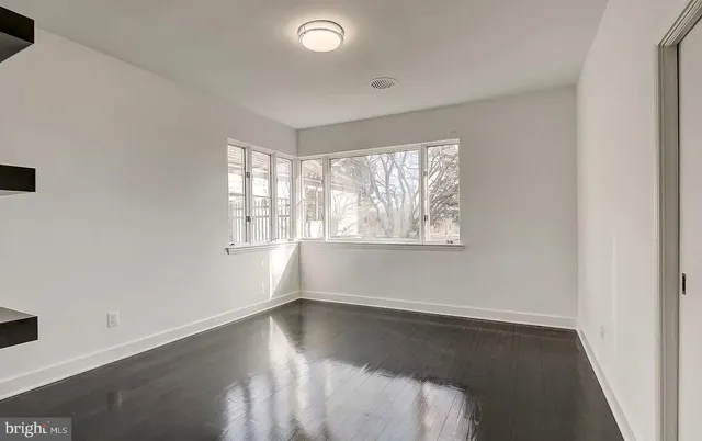 a kitchen with stainless steel appliances a refrigerator and a stove top oven