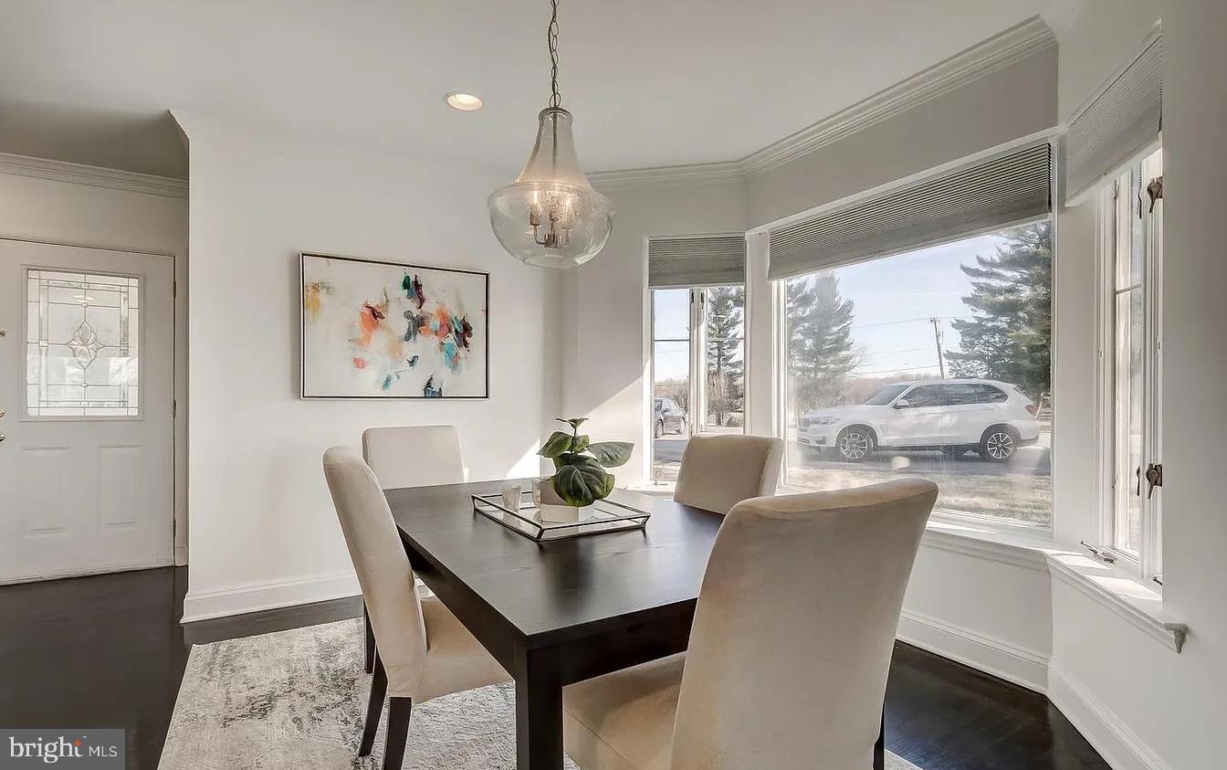 8040 Leishear Road Laurel, MD 20723 - Photo 30 of 66 a view of a dining room with furniture window and wooden floor