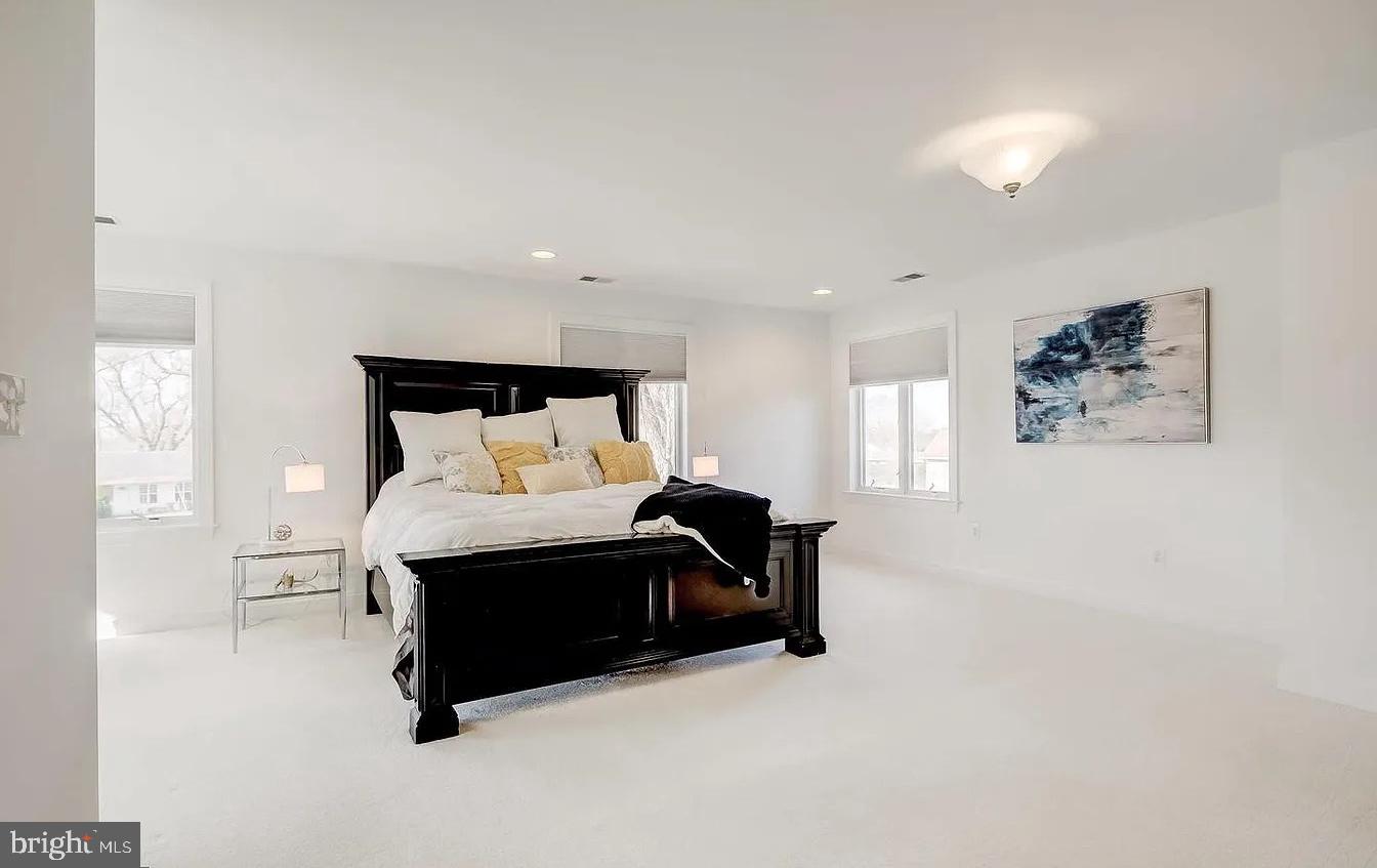 8040 Leishear Road Laurel, MD 20723 - Photo 31 of 66 a bed room with a bed and a painting