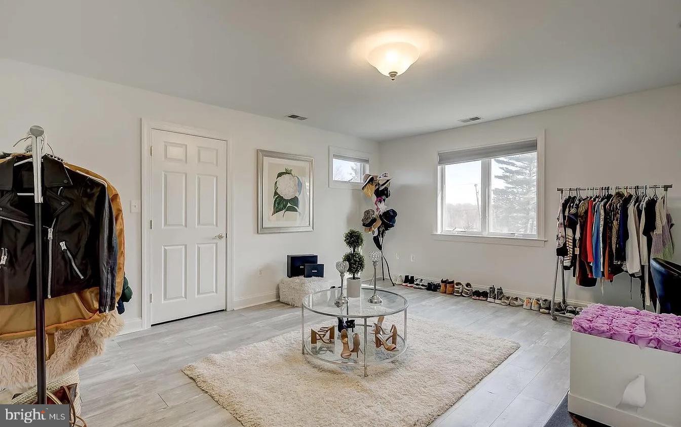 8040 Leishear Road Laurel, MD 20723 - Photo 49 of 66 a living room with furniture and a flat screen tv