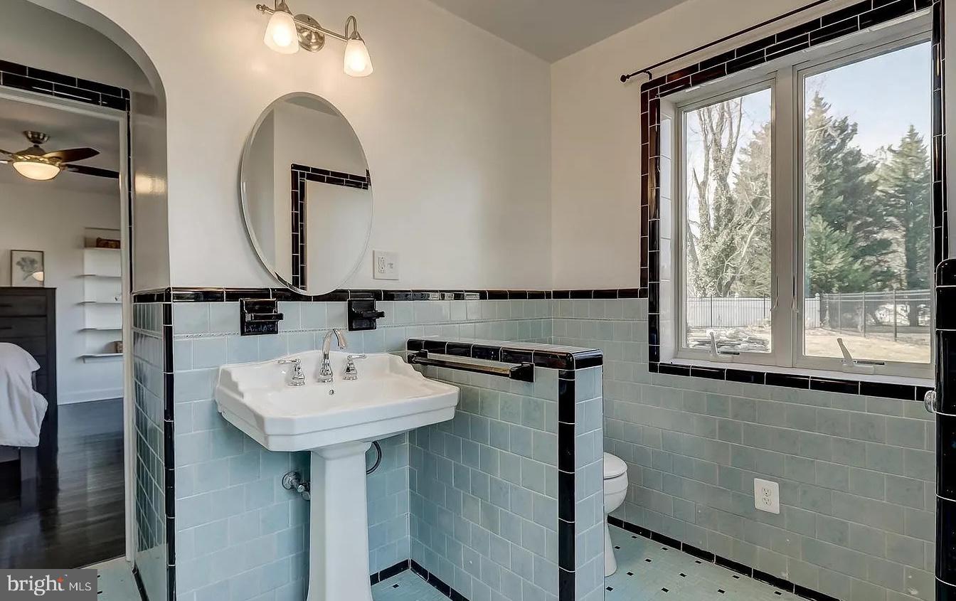 8040 Leishear Road Laurel, MD 20723 - Photo 55 of 66 a bathroom with a sink and a mirror