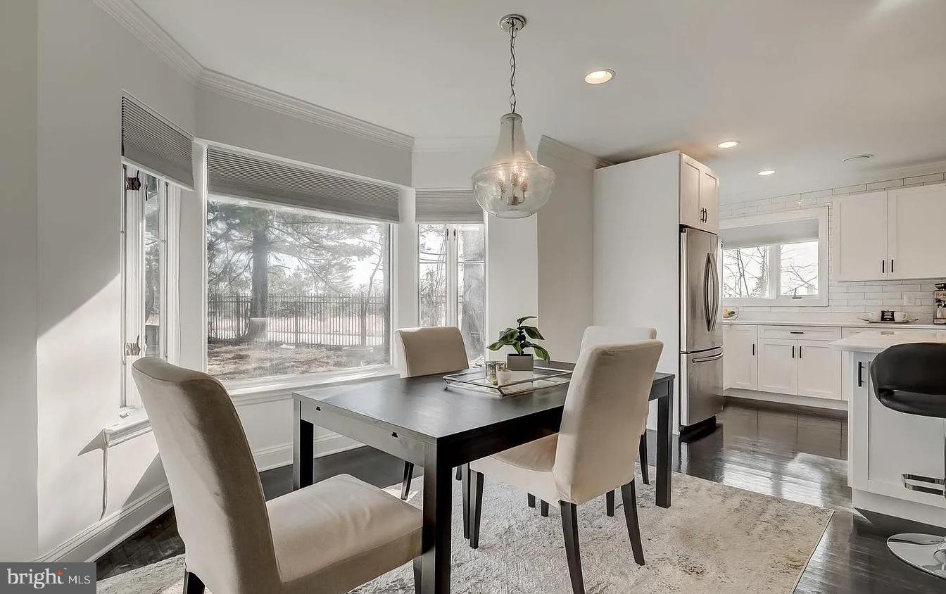8040 Leishear Road Laurel, MD 20723 - Photo 7 of 66 a view of a dining room with furniture window and wooden floor