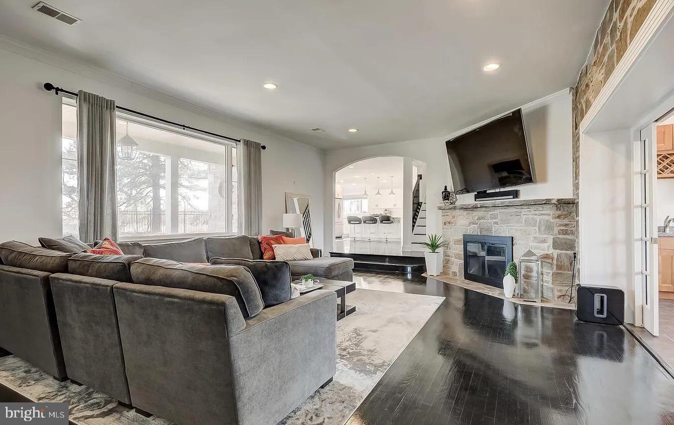 8040 Leishear Road Laurel, MD 20723 - Photo 10 of 66 a living room with fireplace furniture and a flat screen tv