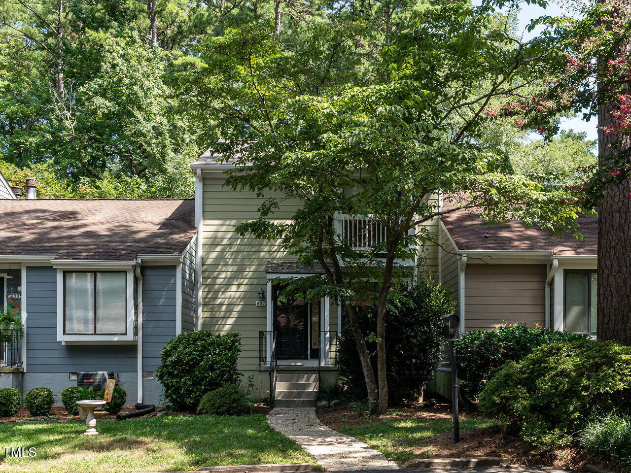 837 Green Ridge Drive Raleigh, NC 27609 - Photo 1 of 29 a front view of a house with garden