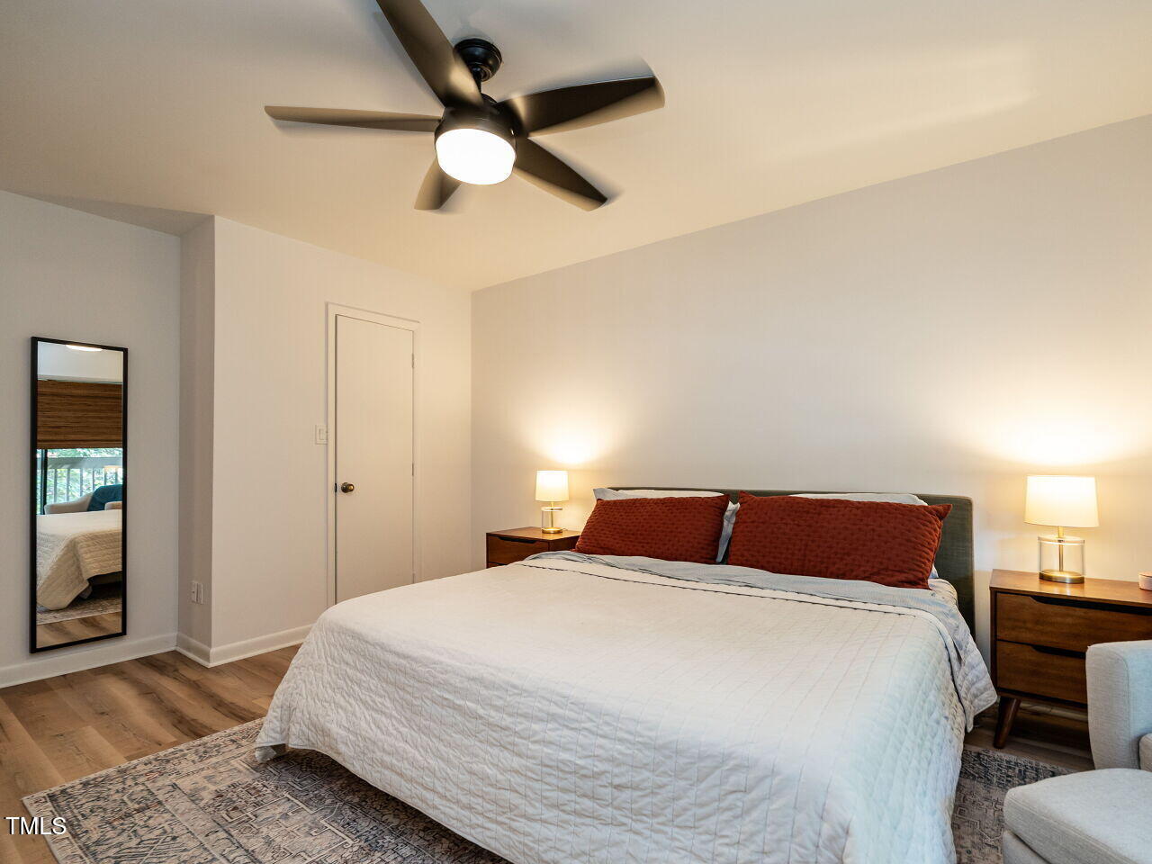 837 Green Ridge Drive Raleigh, NC 27609 - Photo 18 of 29 a bedroom with a bed and a chandelier