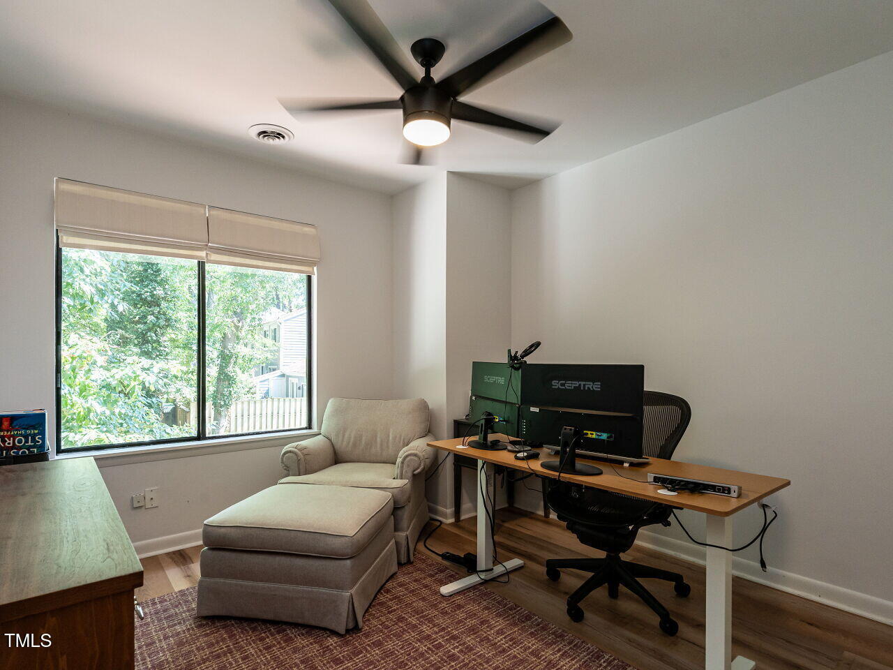 837 Green Ridge Drive Raleigh, NC 27609 - Photo 24 of 29 a living room with furniture a table and a large window