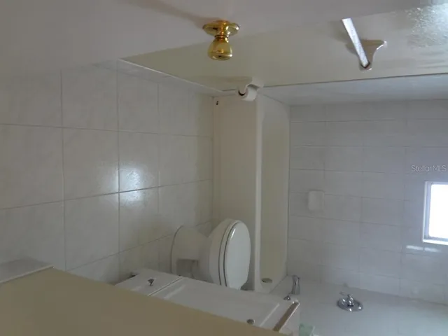 a bathroom with a sink and shower